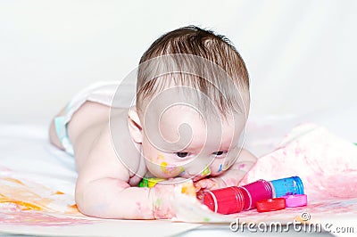 Nice baby draws finger-type paints Stock Photo