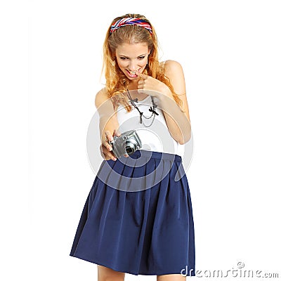 Nice blonde girl in a short skirt takes pictures Stock Photo