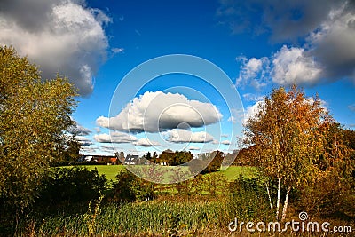 Nice blue sky with clouds formation and trees Stock Photo