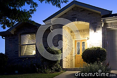 A nice brick house in friendly community night Stock Photo