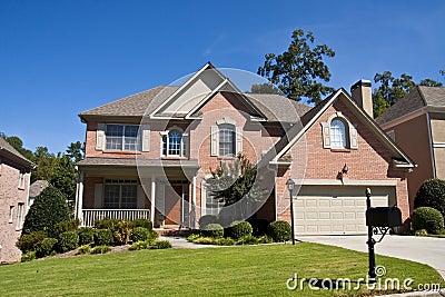 Nice Brick House with Red Door Stock Photo