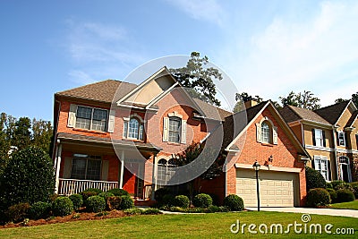 Nice Brick House with Red Door Stock Photo