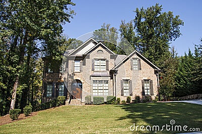 Nice Brick House on Shady Hill Stock Photo