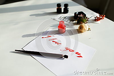 Nice calligraphic card with red inscription I love you on white Stock Photo