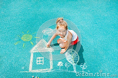 Nice Caucasian little girl draw chalk house image Stock Photo