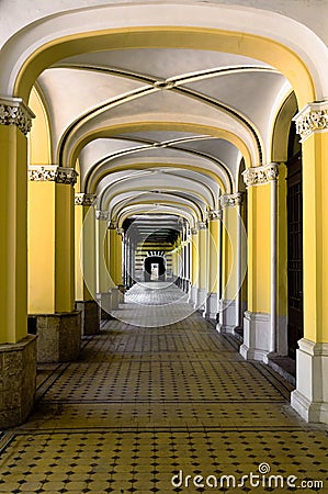 A nice corridor in an old building. Many supporting pillars Stock Photo