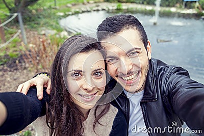 Nice couple boyfriends takes a selfie relaxing Stock Photo