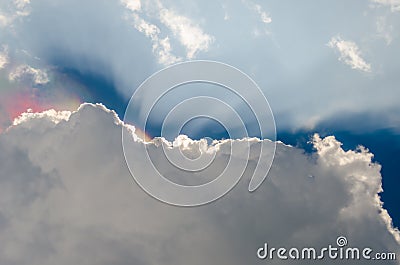 Nice dramatic sky, Iridescence over clouds with sun ray shine Stock Photo