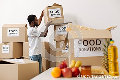 Nice enthusiastic gentleman making an effort for charity Stock Photo