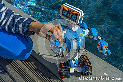 Nice, France 16 October, 2020. Robotics. The Lego Boost robot car. A boy playing with robot Editorial Stock Photo