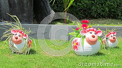 Nice funny welcome figure in asian tropical garden Stock Photo