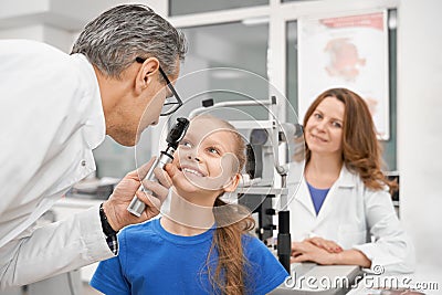 Nice girl checking vision in modern clinic Stock Photo