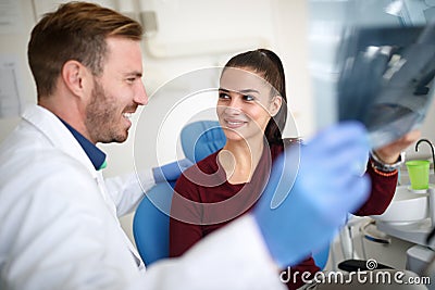 Girl with dentist in clinic take care of her teeth Stock Photo