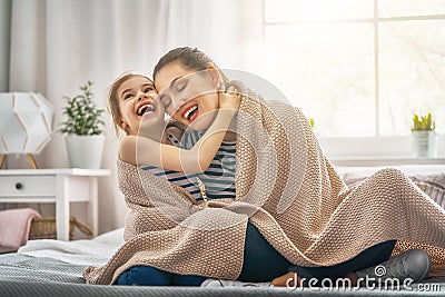 Family playing under blanket Stock Photo