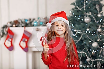 Nice girl playing near Christmas tree Stock Photo