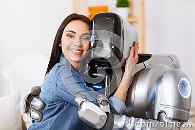 Nice girl and robot embracing Stock Photo