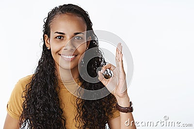 Nice job, like it. Optimistic and supportive nice friendly african-american female friend with curly long hair showing Stock Photo