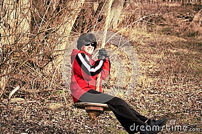 Nice lady on a country swing on a cold day in Idaho Stock Photo