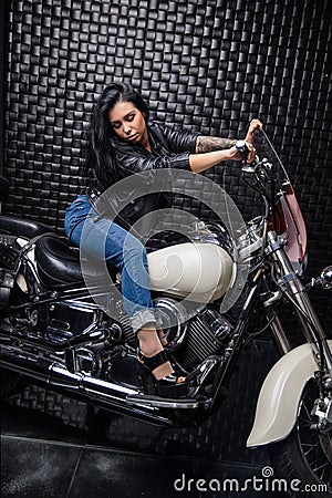 Nice lady posing on a motorcycle Stock Photo