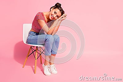 Nice-looking cute sweet attractive glamorous winsome lovely shine cheerful girl wearing striped tshirt jeans sitting on Stock Photo