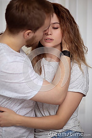 The man gently calms the frightened girl Stock Photo