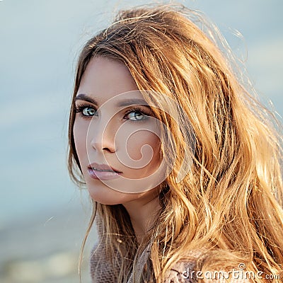 Nice Model Girl with Long Curly Woman with Windy Blowing Hair Stock Photo