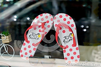 Tour de France cycling promotional flip-flop sandal logo brand and text sign annual multiple Editorial Stock Photo