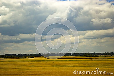 A nice photo of a field with a clouds Stock Photo