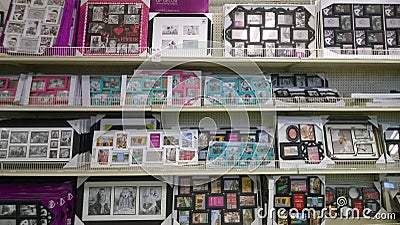 Nice picture frames on shelves selling Editorial Stock Photo