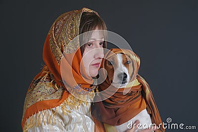 Portrait of beautiful woman with lovely basenji dog both wearing headscarfs Stock Photo