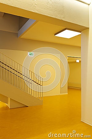 Staircase front view of modern public school with yellow floor. Minimal and elegant Stock Photo