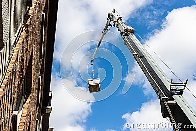 Aerial lift with a basket. Editorial Stock Photo