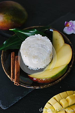 Nice vegetarian sticky rice with mango pieces. Stock Photo