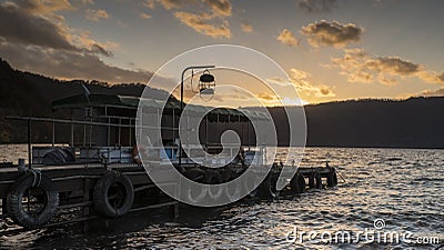Nice view of a sightseeing boat cruising on autumn Lake Towadako in Towada Hachimantai National Park Stock Photo