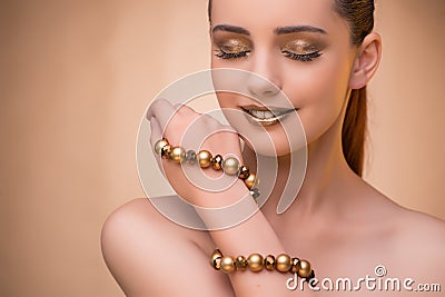 The nice woman wearing elegant jewellery Stock Photo