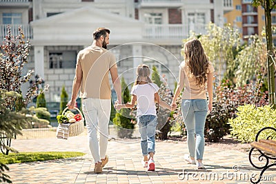 Nice young family walking and looking active Stock Photo