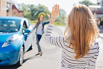 Nice young woman waving with her hand Stock Photo