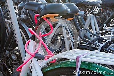 A nicely coloured pink bicycle lock Stock Photo