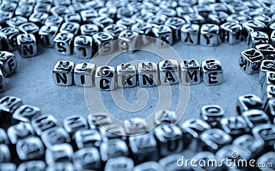 Nickname - Word from Metal Blocks on Paper Stock Photo