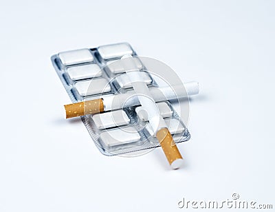 Nicotine gum and tobacco. Stock Photo