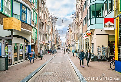 The Nieuwe Hoogstraat with tourist and locals looking for a bargain Editorial Stock Photo