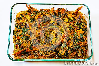 Nigerian Cuisine, Shawa fish Smoke dried herring sardine Efo riro Stock Photo