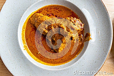 Nigerian Food: Delicious Banga soup on white plate Stock Photo