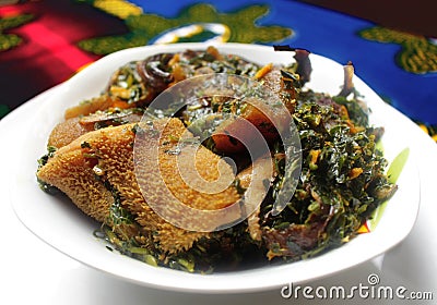 Nigerian Vegetable soup with shaki and kpomo Stock Photo