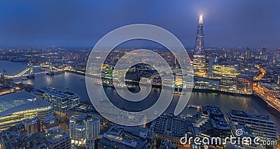 Night aerial view of Thames river, Tower Bridge and The Shard in London, England Stock Photo