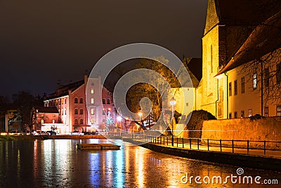 Night architecture in city. Church on the bank of river. Editorial Stock Photo