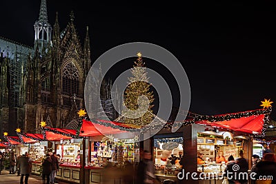 Night atmosphere of Weihnachtsmarkt, Christmas Market in KÃ¶ln. Editorial Stock Photo