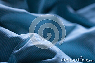 Night blue comfortable sheet on the sleep bed Stock Photo