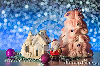 Night bokeh santa claus toy and blurred lights foreground. Big New Year s concept. Market banner, poster. Stock Photo