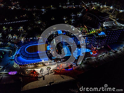 Night bright hotel with dolphin shaped pool Editorial Stock Photo